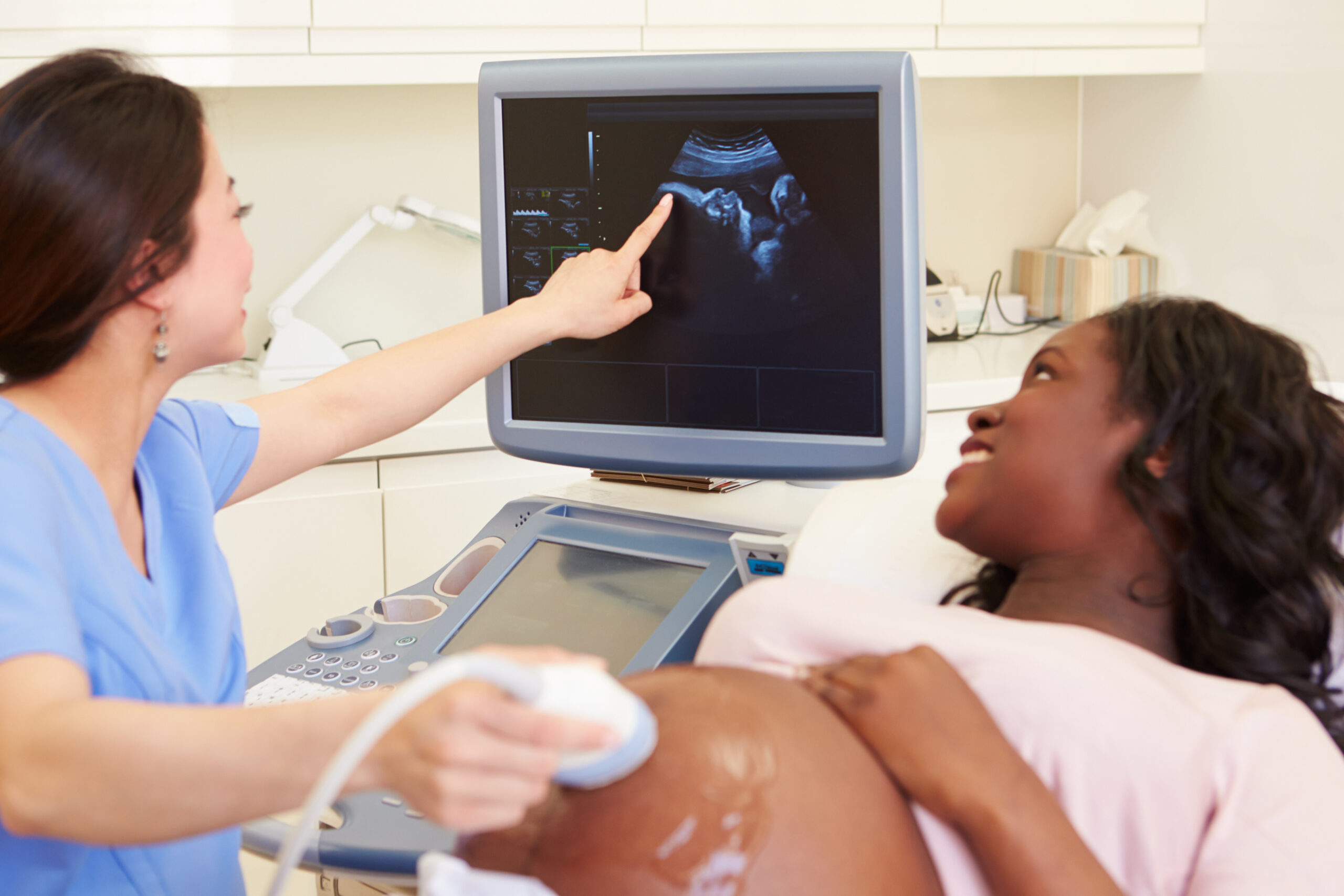 Pregnant Woman Having 4D Ultrasound Scan Pregnant Woman Having 4D Ultrasound Scan